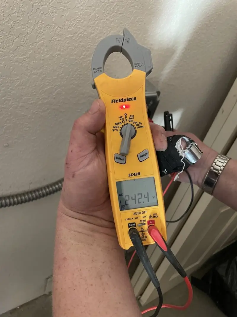 Voltage testing with clamp meter during Circuit Breaker Repair in West Jefferson